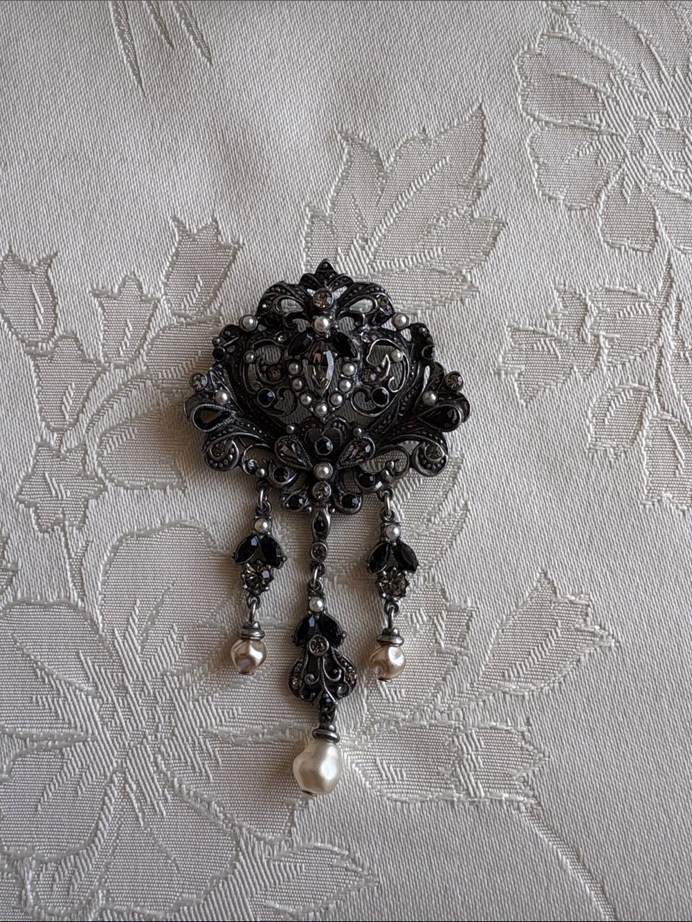 Victorian-Inspired Black and Silver Filigree Brooch with Pearl Drops